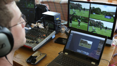 A person working with livestream equipment.
